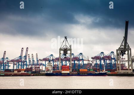 HAMBURG, GERMANY - MARCH, 2018: Industrial port cargo logistics containers and ship cranes in Hamburg Stock Photo