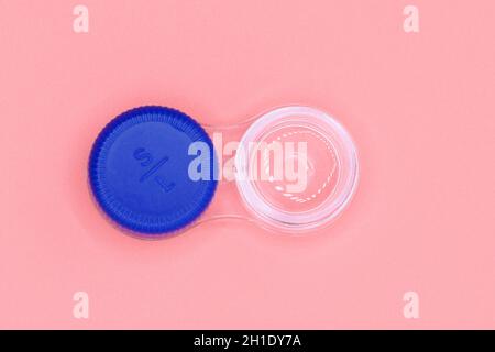 Contact lens case on pink pastel background . Stock Photo