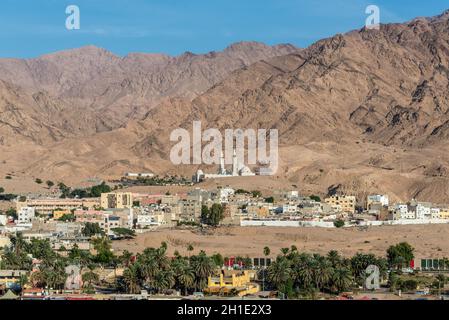 Aqaba, Jordan - November 6, 2017: View of the Shaikh Zayed mosque in the center and the city of Aqaba, Jordan. View from the Red Sea. Stock Photo