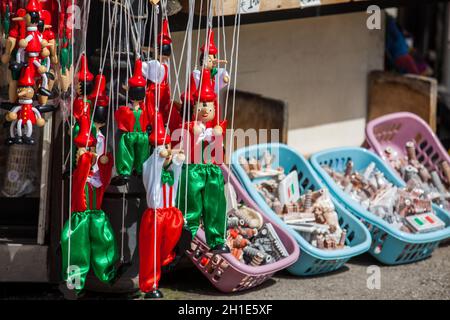 PISA, ITALY - APRIL, 2018: Souvenirs for tourists sold close to the Leaning Tower of Pisa Stock Photo