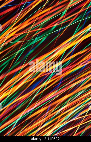 Abstract dynamic background, multicolor oblique light lines. Stock Photo