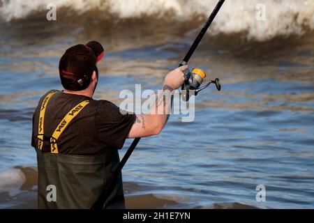 Beach fishing at high tide at Hornsea, Yorkshire. East coast. UK. Stock Photo