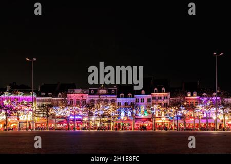 MAASTRICHT, THE NETHERLANDS - NOVEMBER 22, 2016: Bars and restaurants with christmas lights on the famous Vrijthof square in Maastricht Stock Photo