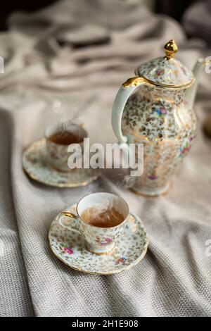 https://l450v.alamy.com/450v/2h1e908/porcelain-tea-pot-and-cup-of-hot-tea-on-the-table-antique-traditional-crockery-set-high-tea-english-afternoon-tea-2h1e908.jpg