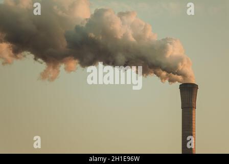 Vintage styled image of air pollution from a factory pipe Stock Photo