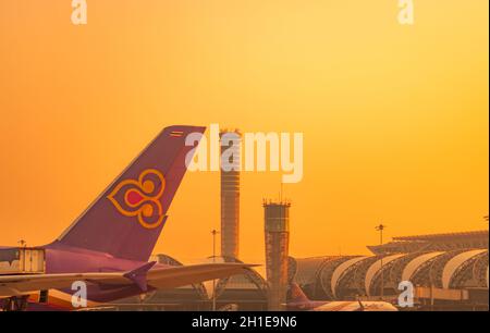 BANGKOK, THAILAND-FEBUARY 20, 2020 : Thai Smile Airways. Passenger plane parked at Suvarnabhumi Airport. Closeup airplane with air traffic control tow Stock Photo