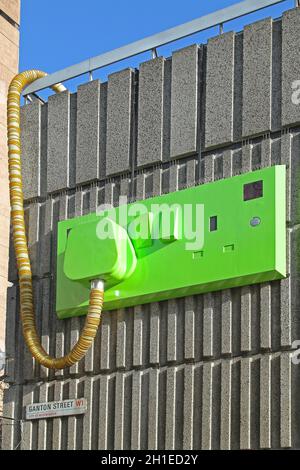 LONDON, UNITED KINGDOM - APRIL 04: Giant Plug and Socket at Electrical Substation in London on APRIL 04, 2010. Green Plug and Socket Urban Art Was Ins Stock Photo