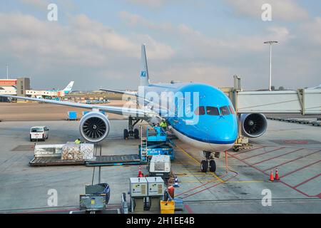 AMSTERDAM, THE NETHERLANDS - MAY 15, 2019: Cargo loaded into a KLM Boeing 787 Dreamliner aircraft at Amsterdam Schiphol International Airport Stock Photo