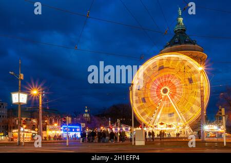 Mannheim, Germany. February, 19th 2012. The ferris wheel of the carnival market at the Wasserturm (Water Tower). Stock Photo