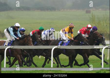 Runners and riders during the Allen Hinchcliffe Memorial Handicap at Pontefract Racecourse, West Yorkshire. Picture date: Monday October 18, 2021. Stock Photo