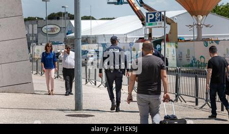 Lisbon, Portugal - May 7, 2018: Policeman patrolling on foot in the Expo district on a spring day Stock Photo