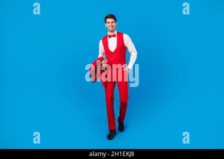 Full size photo of young man happy positive smile hand in pocket confident three-piece isolated over blue color background Stock Photo