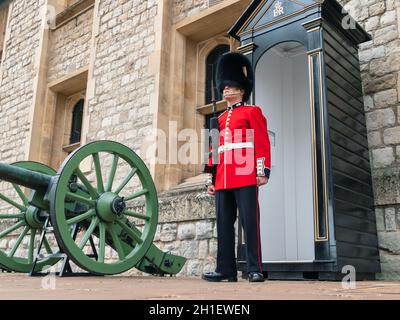 London, UK - April, 2019: Soldier of Royal Guard of London. Soldier of English Guard patrols inside Tower of London in the service of the Queen of Eng Stock Photo