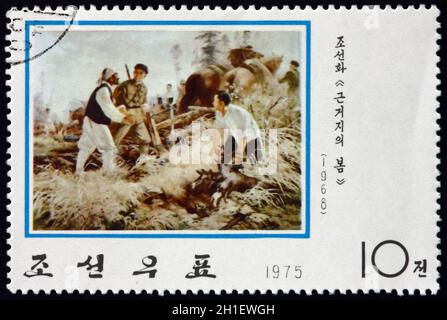 NORTH KOREA - CIRCA 1975: a stamp printed in North Korea shows The Guerrilla Base in Spring (1968), Korean Painting, circa 1975 Stock Photo