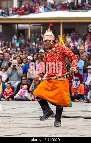 LEH, INDIA - SEPTEMBER 08, 2012: Dancers in traditional Ladakhi Tibetan costumes perform warlike dance at the Annual Festival of Ladakh Heritage in Le Stock Photo