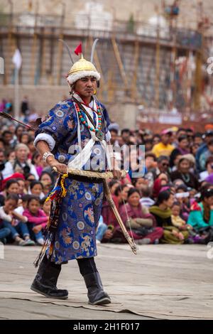 LEH, INDIA - SEPTEMBER 08, 2012: Dancers in traditional Ladakhi Tibetan costumes perform warlike dance at the Annual Festival of Ladakh Heritage in Le Stock Photo