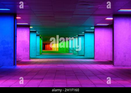 ROTTERDAM, NETHERLANDS - MAY 11, 2017: Colorful mulitcolored illuminated gallery tunnel rainbow passage installation under NAI building, Nederlands Ar Stock Photo