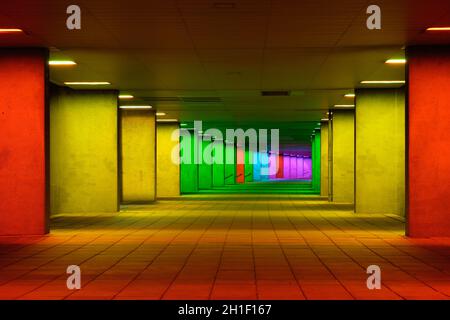 ROTTERDAM, NETHERLANDS - MAY 11, 2017: Colorful mulitcolored illuminated gallery tunnel rainbow passage installation under NAI building, Nederlands Ar Stock Photo