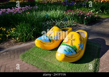 KEUKENHOF, NETHERLANDS - MAY 9, 2017: Traditional wooden clogs klompen shoes in Keukenhof flower garden, one of the world largest flower gardens and p Stock Photo
