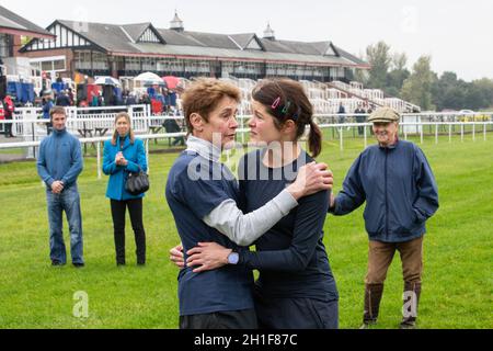 Harriet Bethell receives a hug off her mum after crossing the finish’s ...