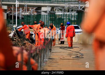 salvador, bahia / brazil - january 12, 2017: Workers are seen working on road construction on Avenida Antonio Carlos Magalhaes in the city of Salvador Stock Photo