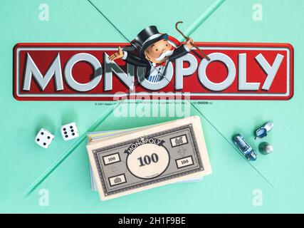 SWINDON, UK - JUNE 11, 2014: English Edition of Monopoly showing The Logo,  The classic trading game from Hasbro was first introduced to America in 19 Stock Photo