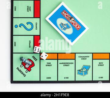 SWINDON, UK - DECEMBER 17, 2014: English Edition of Monopoly showing Free Parking,  The classic trading game from Parker Brothers was first introduced Stock Photo