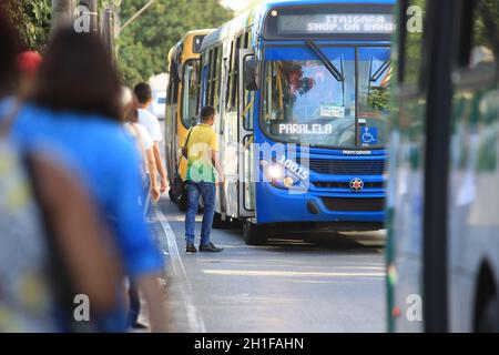 salvador, bahia / brazil  - january 26, 2017: Person is seen waiting for public transportation at a bus stop on Avenida Tancredo Neves, in the city of Stock Photo