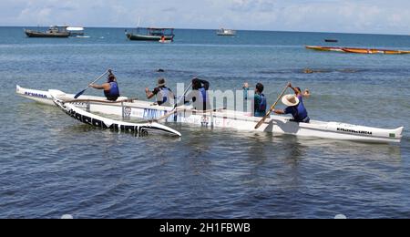 salvador, bahia / brazil - january 24, 2019: People are seen boarding Polynesian canoe on Itapua beach in Salvador.    *** Local Caption *** Stock Photo