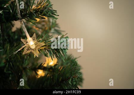 Christmas tree with star-shaped lights Stock Photo