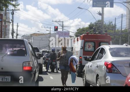 salvador, bahia / brazil - may 30, 2019: Woman is seen watching cloths in a vehicle lane in Salvador. *** Local Caption *** Stock Photo
