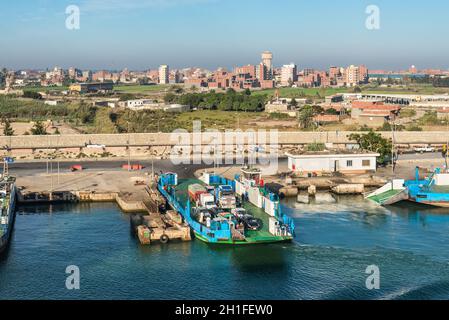 El Qantara, Egypt - November 5, 2017: Cars Ferryboat moored to the shore on the Suez Canal in the city El Qantara located in the Egyptian governorate Stock Photo