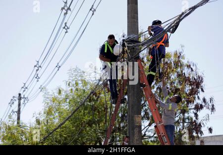 salvador, bahia / brazil - march 12, 2019: Workers are seen making repairs to the electric network in the city of Salvador. *** Local Caption *** Stock Photo