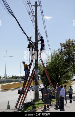 salvador, bahia / brazil - march 12, 2019: Workers are seen making repairs to the electric network in the city of Salvador. *** Local Caption *** Stock Photo