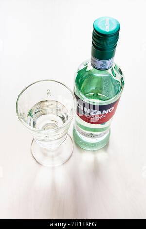 MOSCOW, RUSSIA - JUNE 4, 2020: top view of closed bottle of Cinzano Extra Dry and wineglass with drink on table. Cinzano is Italian vermouth from Turi Stock Photo