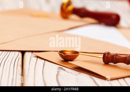 Close up of a Christmas letter with wax seal stamp on wooden table Stock Photo