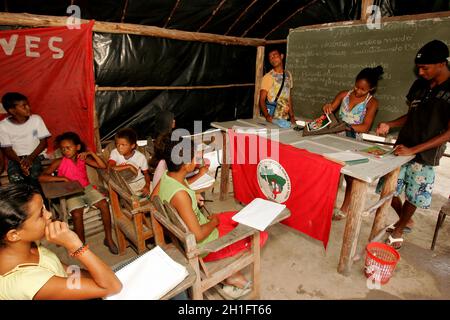 eunapolis, bahia / brazil - november 24, 2010: Member of the Landless Movement - MST - they are seen in a makeshift school camp on the banks of the BR Stock Photo