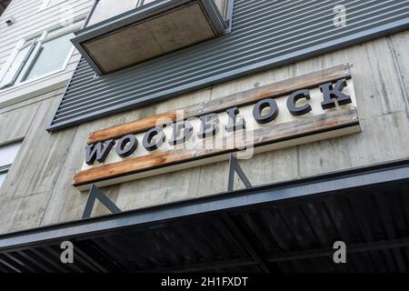 Redmond, WA USA - circa August 2021: Low angle view of the entrance to Woodblock upscale restaurant. Stock Photo