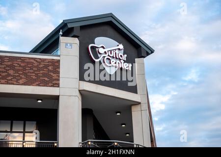 Redmond, WA USA - circa August 2021: Low angle view of the entrance to a Guitar Center store downtown. Stock Photo