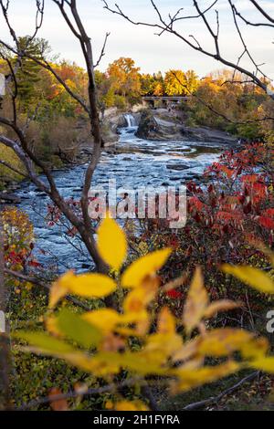 The Hog's Back Falls and Bridge, Prince of Wales Falls waterfalls on the Rideau River in Ottawa in autumn season. Colorful nature in park with river Stock Photo