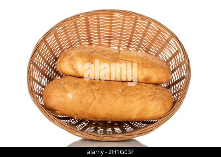 Two fragrant ciabatta in a straw bowl, close-up, isolated on white. Stock Photo