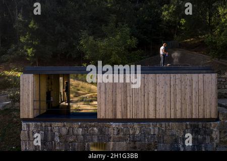 Timber clad facade and view through. Pavilion House, Guimarães, Portugal. Architect: Diogo Aguiar Studio, 2019. Stock Photo