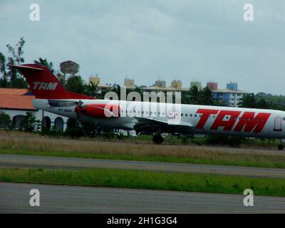 salvador, bahia / brazil - august 2, 2005: model aircraft Fokker 100 Tam Linhas Aereas is seen in landing procedure on the runway of Salvador airport. Stock Photo