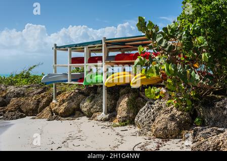 Le Gosier, Guadeloupe - December 20, 2016: Racks of plastic kayaks for rent at a sea resort, the Gosier in Guadeloupe island, Caribbean. Travel, Touri Stock Photo