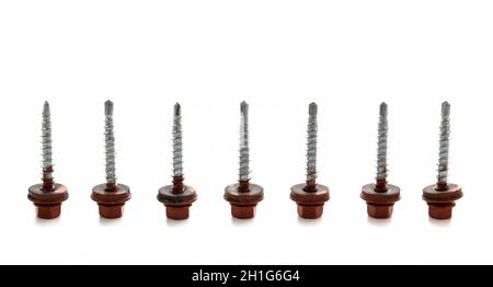 Group of roofing screws isolated on white. Metal Roofing Screws Stock Photo