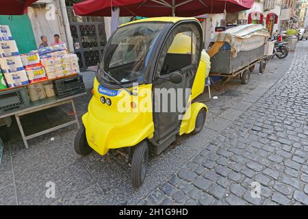 Naples, Italy - June 23, 2014: Poste Italiane Small Electric Utility Vehicle in Naples, Italy. Stock Photo