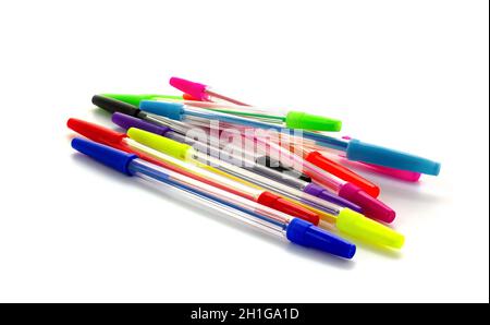 Multicolored pens isolated on white background. Ballpoint pens lie on white Stock Photo