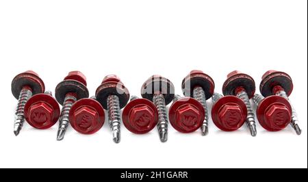 Metal Roofing Screws. Colored self-tapping screws for metal with a hex head drill on a white background. Stock Photo