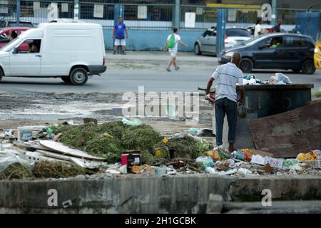 salvador, bahia / brazil - june 1, 2017: person is seen beside the trash collecting material for recycling in the city of Salvador.    *** Local Capti Stock Photo