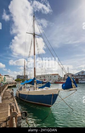 Bridgetown, Barbados - December 18, 2016: Sailing yacht moored in the downtown marina of Bridgetown, Barbados, Caribbean.